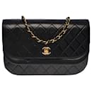 Beautiful Chanel Classique flap bag handbag in black quilted lambskin, garniture en métal doré