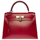 Exceptional Hermès Kelly handbag 28 saddler in red box leather H, gold plated metal trim,
