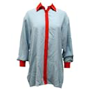 Camisa de botones con detalles rojos en seda azul de Etro