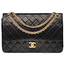Subime sac à mains Chanel Timeless/Classique 27 cm en cuir matelassé noir, garniture en métal doré