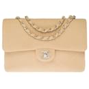 Beautiful Chanel Timeless/Classic medium flap bag handbag in beige jersey , Garniture en métal argenté