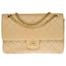 Very beautiful Chanel Timeless/Classique Coco handbag with lined flap in beige quilted lambskin