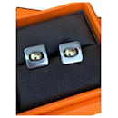 Beautiful stud earrings in silver and gold - Hermès