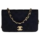 Beautiful Chanel Full flap mini handbag in navy blue quilted suede, garniture en métal doré
