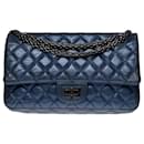 Splendid and Rare Chanel handbag 2.55 small model in iridescent metallic blue quilted leather, black ruthenium metal trim