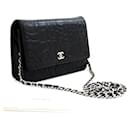 CHANEL Black Camellia Embossed Wallet On Chain WOC Shoulder Bag SV - Chanel