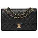 Exceptional Chanel Timeless medium bag 25 cm with lined flap in black quilted lambskin, garniture en métal doré