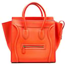 Céline Luggage mini bag in fluro orange leather