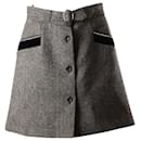 Minifalda con bolsillo de espiga de Miu Miu en lana gris Laine