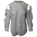 Blusa de algodón blanco con hombros descubiertos y encaje de Sandro Paris
