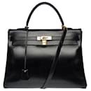 Beautiful Hermès Kelly bag 35 returned shoulder strap in black box leather, gold plated metal trim