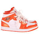 Nike Air Jordan 1 Mid Sneakers in Electro Orange Leather