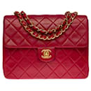 Superb Chanel Mini Timeless Flap bag in red quilted lambskin,garniture en métal doré
