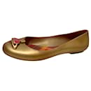 Vivienne Westwood Anglomania ballet flats in gold with the iconic Orb