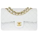 The coveted Chanel Timeless bag 23cm with lined flap in white quilted lambskin