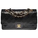 The coveted Chanel Timeless Medium bag 25 cm with lined flap in black quilted lambskin
