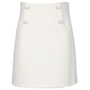 Sandro Pearl Button Mini Skirt in Ecru Cotton
