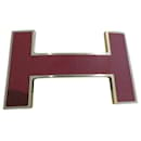 Hermès belt buckle quiz model in gold steel and burgundy dustbag