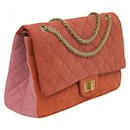 Chanel 2.55 reissue limited edition 2009/2010 tricolor orange, pink, and red denim 227 lined flap Classic bag with Gold hardware