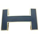 Hermès belt buckle, quiz model, in gold and black brass-plated steel