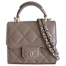 Beige classic Chanel mini bag