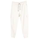 Pantalones Brunello Cucinelli con bolsillos cargo en algodón color crema