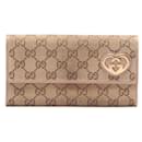 Portafoglio lungo in tela Gucci GG Canvas Lovely Heart 251861 in buone condizioni