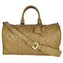 Chanel quilted travel bag in beige patent leather