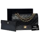 Chanel Timeless / Classique handbag 27cm with flap in black quilted lambskin