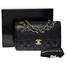 Chanel Timeless shoulder bag 23 cm with lined flap in black quilted lambskin