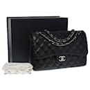 Chanel Timeless Jumbo lined flap handbag in black quilted lambskin