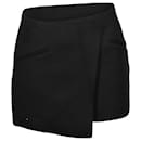 Khaite Ver Asymmetric Mini Skirt in Black Wool