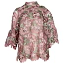 Blusa de encaje floral con cuello alto de Anna Sui en poliéster rosa