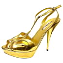 Golden Prada high heeled sandals