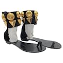 Giuseppe Zanotti sandals in black suede with large gold ankle trim