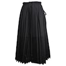 Falda midi plisada en poliéster negro de Comme Des Garcons