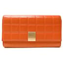 CHANEL CHOCOLATE BAR WALLET IN ORANGE QUILTED LEATHER COIN WALLET - Chanel