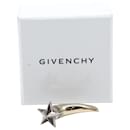 Boucle d'oreille dent de requin étoile magnétique Givenchy en métal doré