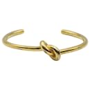 Céline Open Knot Bracelet in Gold Metal
