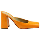 Bottega Veneta Square Toe Block Heel Mules in Orange Patent Leather