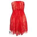 Tibi, Strapless lace dress in orange.