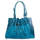 BURBERRY, turquoise woven leather bag with embossed croc print. - Burberry