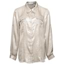 Calvin Klein, Plata metálica / blusa beige con 2 bolsillos en el pecho en talla M.