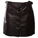 Agnis B, black leather skirt with buttons in the front in size FR42/M. - Agnès b.