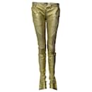 Balmain, metallic gold leather biker pants.
