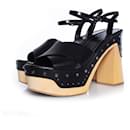 Prada, platform wooden heels in black