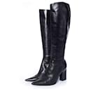 Michel Perry, Black leather boots with pointed toe.