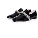 CHRISTOPHER KANE, Black patent leather DNA chain loafers. - Christopher Kane