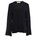 Marni, Black blouse with bow and flutter sleeves.
