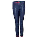Isabel Marant, Blue leather leggings with red details.